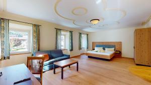 Postel nebo postele na pokoji v ubytování Hotel Daxer