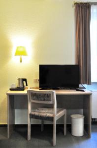 TV a/nebo společenská místnost v ubytování Hotel Garni Haus Dornheim
