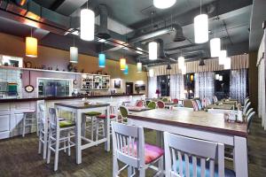 Manufactura Design-Hotel tesisinde bir restoran veya yemek mekanı