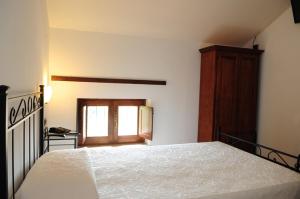 Postel nebo postele na pokoji v ubytování Hotel Dei Templi