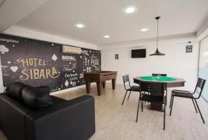 a living room with a ping pong table and a ping pong ball at Hotel Sibara SPA & Convenções in Balneário Camboriú +64 photos