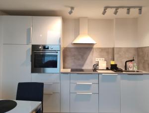 Kuchyňa alebo kuchynka v ubytovaní Sunshine Residence Deluxe Apartment