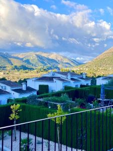 a view of a town with mountains in the background at Stunning mountain views! Private Villa with fabulous communal pool! in Murla