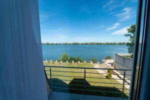 a view of the water from the balcony of a house at Vila Biser Dunava (Pearl of Danube Villa) in Smederevo