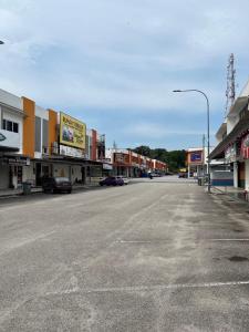 an empty street in a town with buildings at Hijauan Studio Unit @ Ocean View Resort in Port Dickson