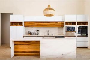 a kitchen with white cabinets and a sink at 8bd Villa ✪ Top Luxury & Exclusive Villa ✪ up to 24 guests in San José Pinilla