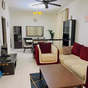 a living room with a couch and a table at Azlina Homestay Jerantut in Jerantut