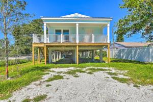 a large house with a deck on a beach at Near Downtown and Ocean Sarasota Getaway in Sarasota