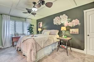 a bedroom with a bed and a table with a lamp at Riverfront Zanesville Getaway with Private Bar! in Dresden