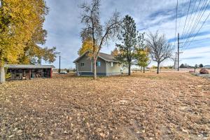 a house in the middle of a field at Cozy Retreat with Yard Space about 11 Mi to Longmont! in Platteville