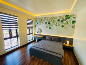 En eller flere senge i et værelse på Hương Cảng Homestay