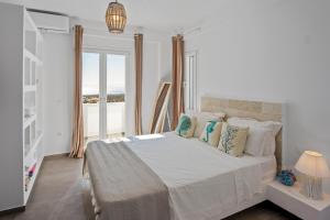 A bed or beds in a room at Coraline Villa