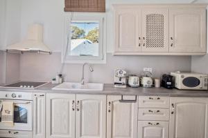 A kitchen or kitchenette at Coraline Villa