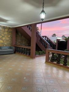 a living room with a staircase in a house at Villa a tamaris dar bouazza in Casablanca