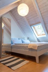 a bedroom with a bed in a attic at Ferienwohnung Spessart - a13250 in Straßbessenbach