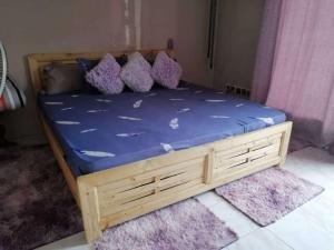 En eller flere senge i et værelse på Bienvenue CHEZ VOUS