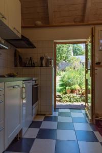 a kitchen with a blue and white tile floor at Ferienwohnung-Spessart in Straßbessenbach