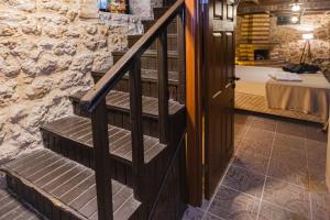 A bed or beds in a room at Casa Maria Hotel