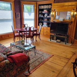 a living room with a couch and a table at Art and Lodging in South Bend