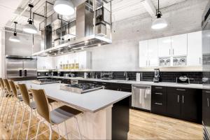 a large kitchen with a large white counter top at Trumbull Apartments Elevator WI-FI XL CENTER Hartford CT in Hartford