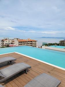 a large swimming pool on the roof of a building at Nayri Beach and restaurant row in Puerto Vallarta