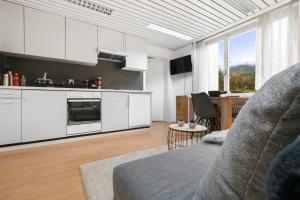 Kuchyň nebo kuchyňský kout v ubytování Appartement confortable avec un sauna