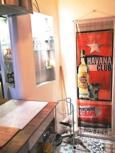 a poster of a bottle of hawaiian glue on a wall at plein coeur du quartier du Panier . Chaleureux T2. in Marseille