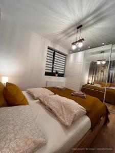Posteľ alebo postele v izbe v ubytovaní Apartament Na Szlaku
