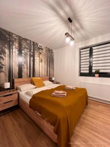 Posteľ alebo postele v izbe v ubytovaní Apartament Na Szlaku