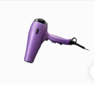 a purple hair dryer on a white background at Gorgeous apartment with free parking & breakfast near city centre & midday checkout in Bristol