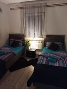 Posteľ alebo postele v izbe v ubytovaní Studio apartman"Mirjana", Podhum 368