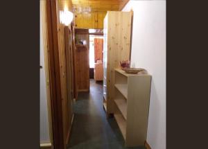 a hallway of a house with a counter and a room at Genepy Cervinia apartment Vda Vacanze in Vetta CIR 0252 in Breuil-Cervinia