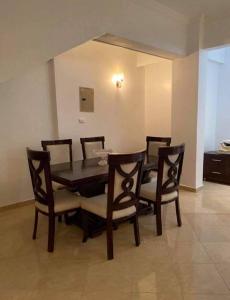 a dining room with a table and chairs at Villa Sky in Hurghada