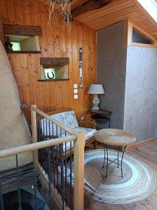 a room with a staircase in a cabin at Gîte Sainte Croix en Jarez, Le Val des Equins in Sainte-Croix-en-Jarez