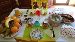 a table with eggs and other food on it at Villa Chiara Affascinante Villino in Monsampolo del Tronto
