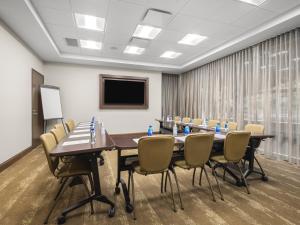a conference room with a long table and chairs at Staybridge Suites Seattle - South Lake Union, an IHG Hotel in Seattle
