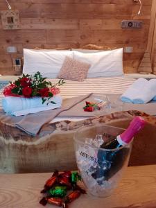 a bedroom with a bed with flowers on it at L'Arbergh Palanfrè in Vernante