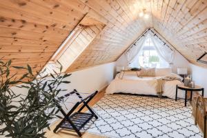 a bedroom with a bed in a attic at Fully Equipped Home Close to Malmö & Copenhagen in Vellinge