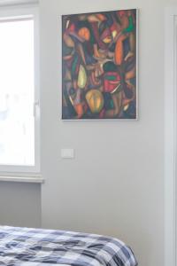 A bed or beds in a room at La Dolce Vita - Sunny Penthouse Trastevere Station 100sqm