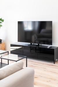 A television and/or entertainment centre at La Dolce Vita - Sunny Penthouse Trastevere Station 100sqm