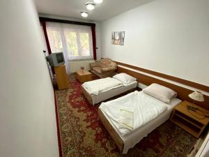 Ein Bett oder Betten in einem Zimmer der Unterkunft Penzión Jazmín
