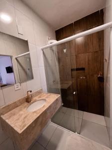 a bathroom with a sink and a shower at Vila Moana Jeri in Jericoacoara