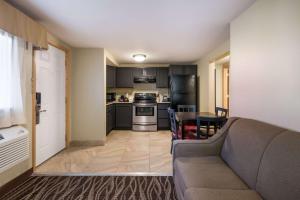 a living room with a couch and a table at Best Western Weston Inn in West Yellowstone