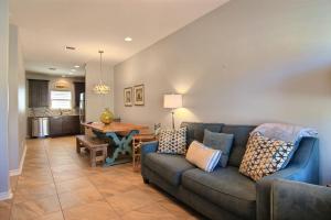 a living room with a couch and a table at Family Tides Beach House in Port Aransas