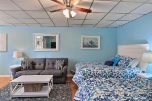a living room with a couch and a bed at On the Half Shell in Port Aransas