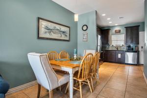 a kitchen and dining room with a table and chairs at Sweet Retreat in Port Aransas