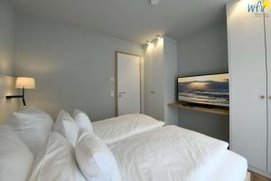 Postel nebo postele na pokoji v ubytování Toewerhus - Wohnung Robbe