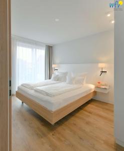 Postel nebo postele na pokoji v ubytování Toewerhus - Wohnung Muschel