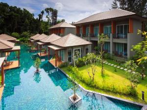 an aerial view of a resort with a large swimming pool at Khaolak Forest Resort in Khao Lak