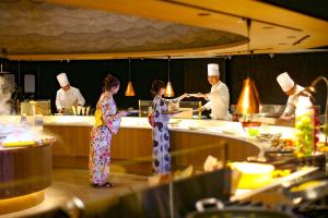 a group of chefs in a kitchen preparing food at TAOYA Shima in Toba +19 photos